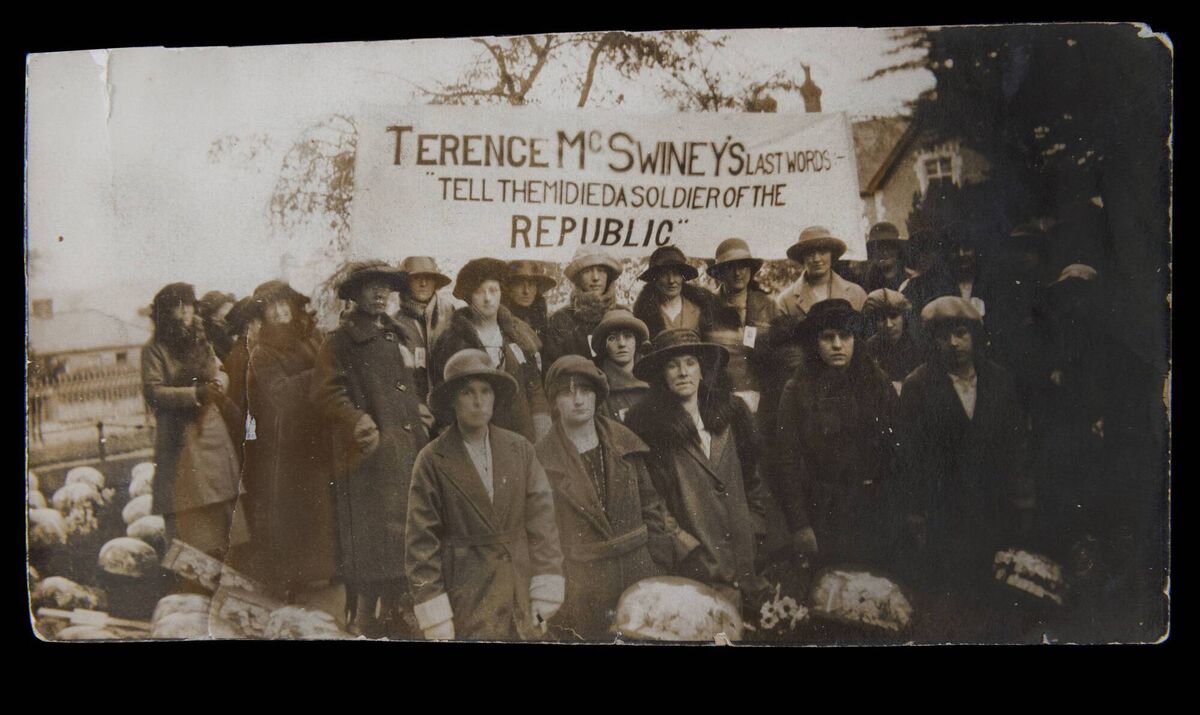 A group of Cumann na mBan members, bearing a banner with the last words of slain Cork mayor Terence McSwiney. Pic: Cork Public Museum