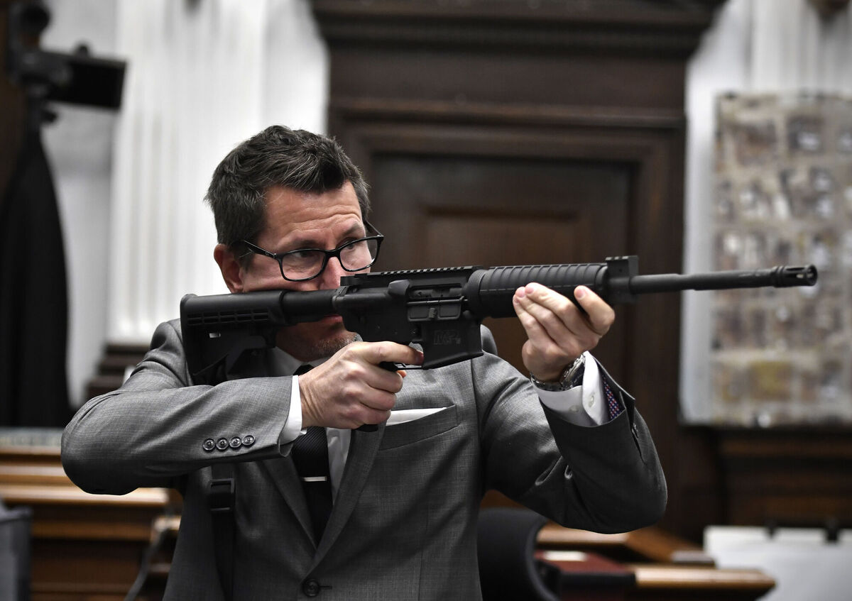 Assistant District Attorney Thomas Binger holds Kyle Rittenhouse's gun as he gives the state's closing argument in Kyle Rittenhouse's trial. Picture: Sean Krajacic/The Kenosha News via AP, Pool