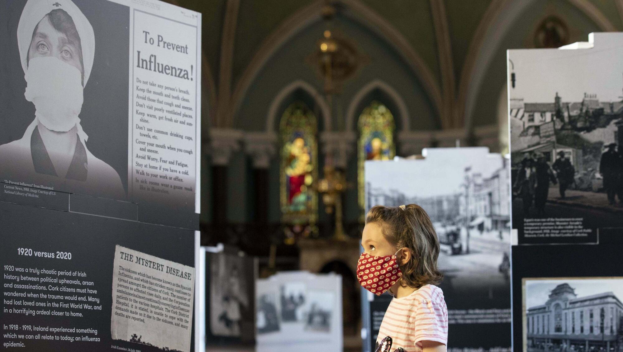 Rosie O'Toole discovering how sometimes history repeats itself at the Small Lives exhibition, including this panel about the 1918 flu pandemic, at Cork's Nano Nagle Centre in September 2020. Picture: Clare Keogh
