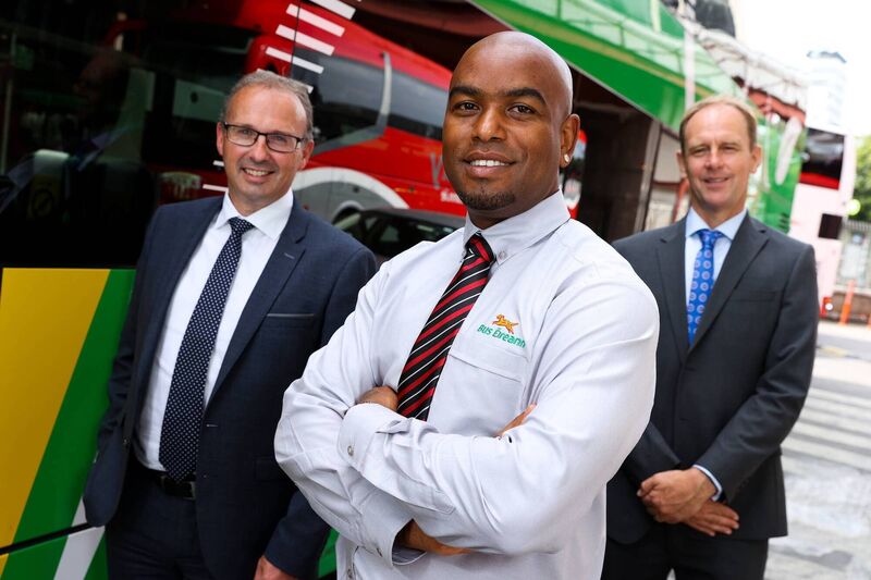 Bus Éireann Driver, Georges Gabriel, Broadstone Depot Dublin, with Bus Éireann CEO Stephen Kent, and Chief Customer Officer Allen Parker, at the launch of the new Bus Éireann uniforms