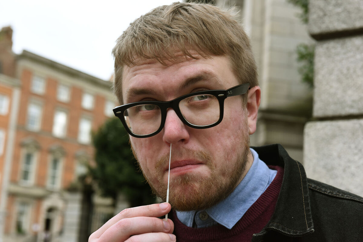 Swab goes in one nostril, swirl it around, and then repeat for the second one. Yuck. Picture: Moya Nolan