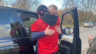 <p>Handout photo of Ole Gunnar Solskjaer hugging a fan after leaving Manchester United's training ground. Picture: @lukesellers98 via PA</p>