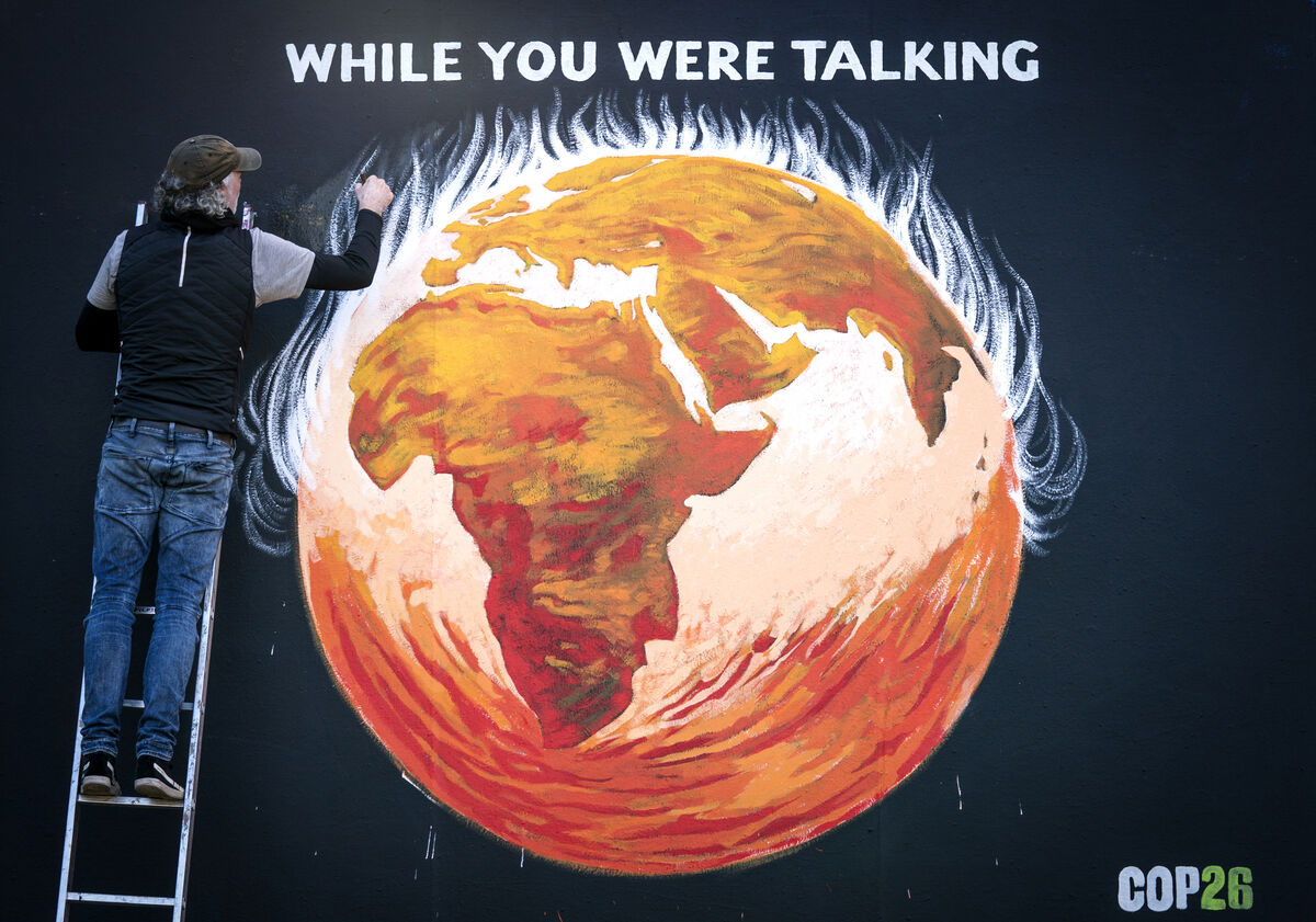 Justice and Peace artist Greg Mitchell completes his climate-crisis themed mural that depicts the Earth on fire and reads 'While you were talking', on the side of St John's Church on Princes St, Edinburgh, to coincide with the Cop26 in Glasgow last month. Justice and Peace artist Greg Mitchell completes his climate-crisis themed mural that depicts the Earth on fire and reads 'While you were talking', on the side of St John's Church on Princes St, Edinburgh, to coincide with the Cop26 in Glasgow last month.