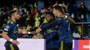 <p>Manchester United's Cristiano Ronaldo (right) celebrates scoring their side's first goal of the game</p>