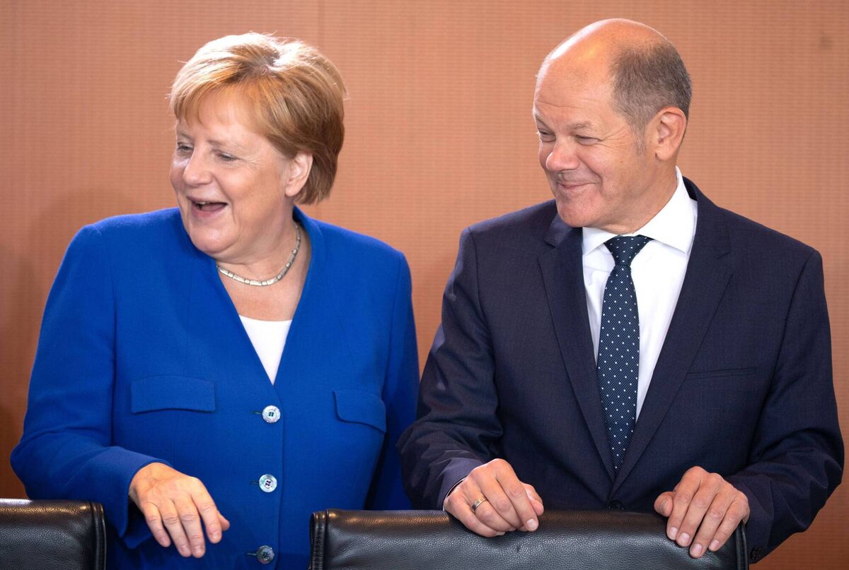 Olaf Scholz with Angela Merkel in 2019 in Berlin,. Picture: Omer Messinger/Getty Images