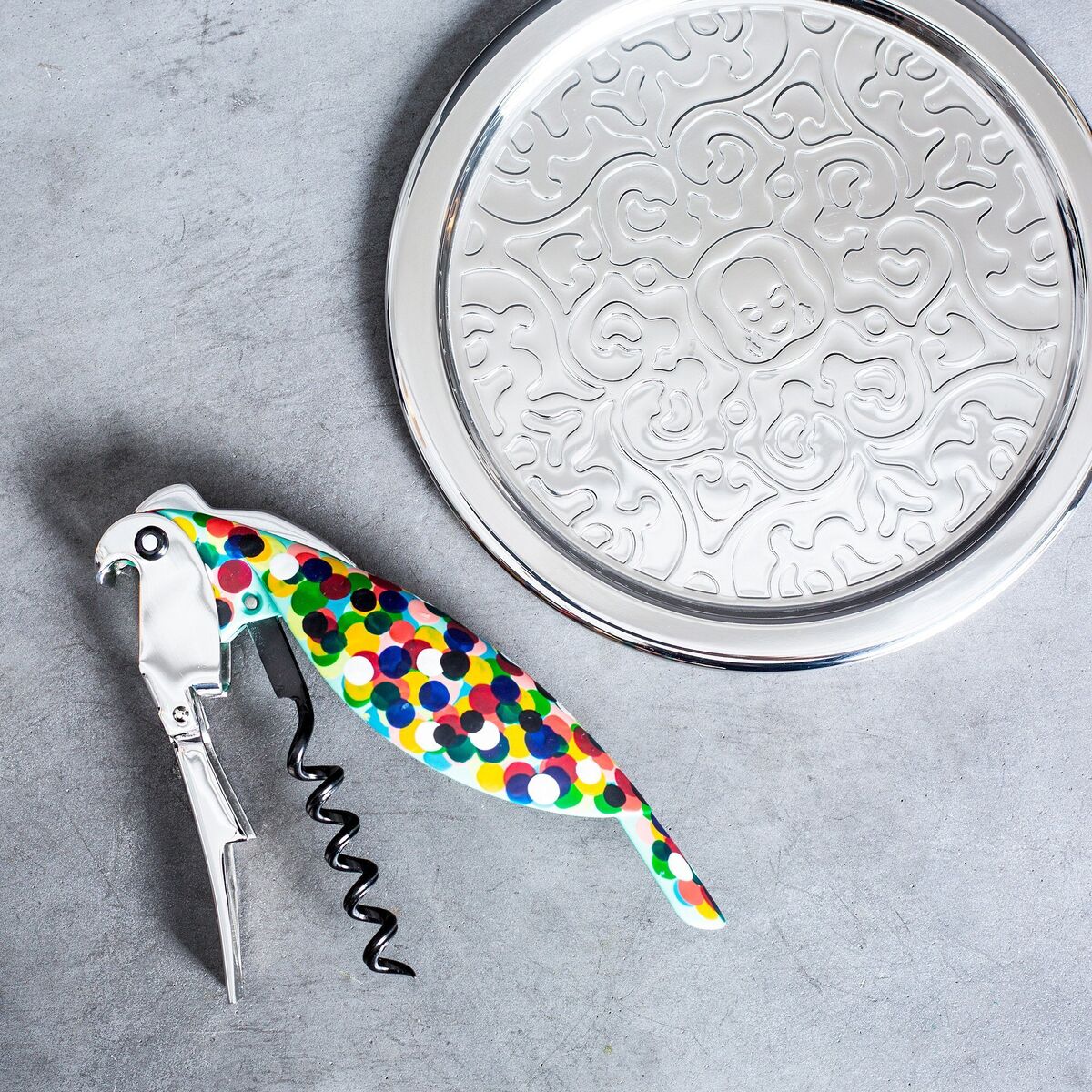The sommelier corkscrew, designed by Alessandro Mendini, is a pocket-sized parrot-shaped corkscrew that can peck off a bottle top or act as a classic bottle popper. These birdies should land in the area of €40-€50 The sommelier corkscrew, designed by Alessandro Mendini, is a pocket-sized parrot-shaped corkscrew that can peck off a bottle top or act as a classic bottle popper. These birdies should land in the area of €40-€50