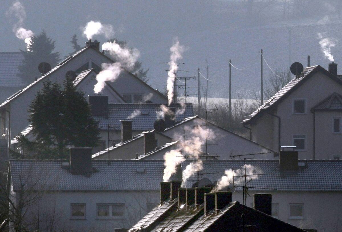 Smoke rises from the chimneys of houses on a cold and crisp winter's day; the era of fire is coming to an end whether we like it or not. Picture: Frank Rumpenhorst Smoke rises from the chimneys of houses on a cold and crisp winter's day; the era of fire is coming to an end whether we like it or not. Picture: Frank Rumpenhorst