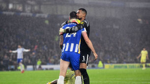 <p>Brighton and Hove Albion's Shane Duffy is embraced by team-mate Robert Sanchez during a Premier League clash earlier this year. Picture: Ashley Western/PA</p>