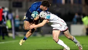 <p>Leinster's Jimmy O’Brien is tackled by Mick Lowry of Ulster</p>