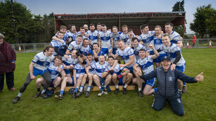 <p>Maurice Hickey captain of Castleisland Desmonds and his teammates with the cup after his team won the game. Picture: Domnick Walsh</p>