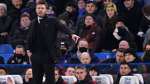 <p>Manchester United caretaker manager Michael Carrick on the touchline as Cristiano Ronaldo (front right) sits on the bench</p>