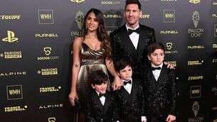 <p>Paris Saint-Germain's Argentine forward Lionel Messi (Top R), his wife Antonela Roccuzzo (top L), and their children (down, L-R) Ciro, Mateo and Thiago pose upon arrival to attend the 2021 Ballon d'Or France Football award ceremony at the Theatre du Chatelet in Paris on November 29, 2021.  (Photo by ANNE-CHRISTINE POUJOULAT/AFP via Getty Images)</p>