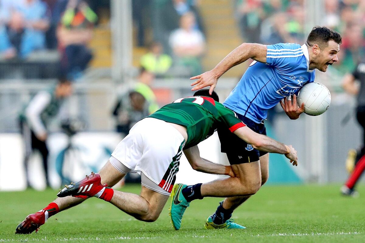 Mayo's Kevin McLoughlin with Kevin McManamon of Dublin. Picture: INPHO/Tommy Dickson Mayo's Kevin McLoughlin with Kevin McManamon of Dublin. Picture: INPHO/Tommy Dickson