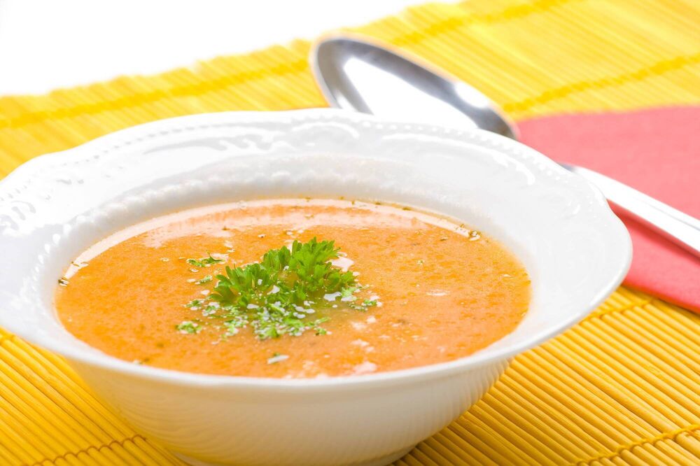 Swede and bacon soup with parsley oil