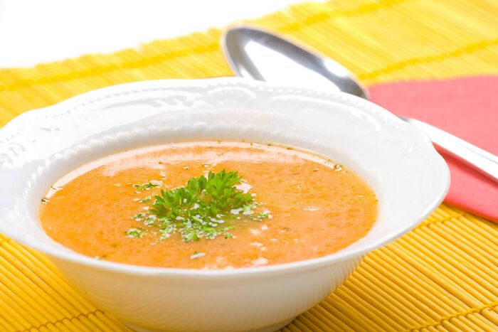 Swede and bacon soup with parsley oil