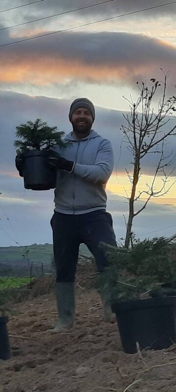 Colm Crowley with one of his pot-grown trees. 