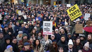 <p>Demonstrators against the new Covid certification system protest outside Belfast City Hall (Brian Lawless/PA)</p> <p>Demonstrators against the new Covid certification system protest outside Belfast City Hall (Brian Lawless/PA)</p>