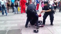 VIDEO: 'Spider-Man' held for punching cop