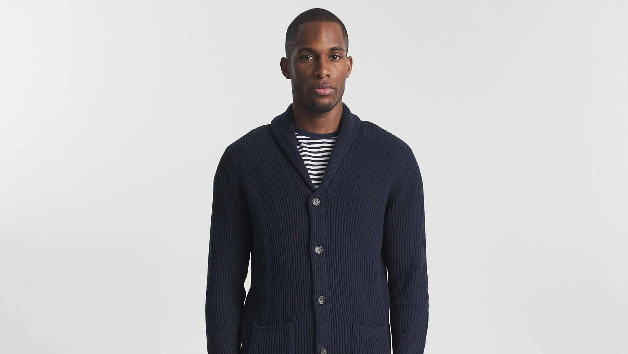 The granddad chic cardigan keeps the festive look smart yet casual as seen at Oxendales.