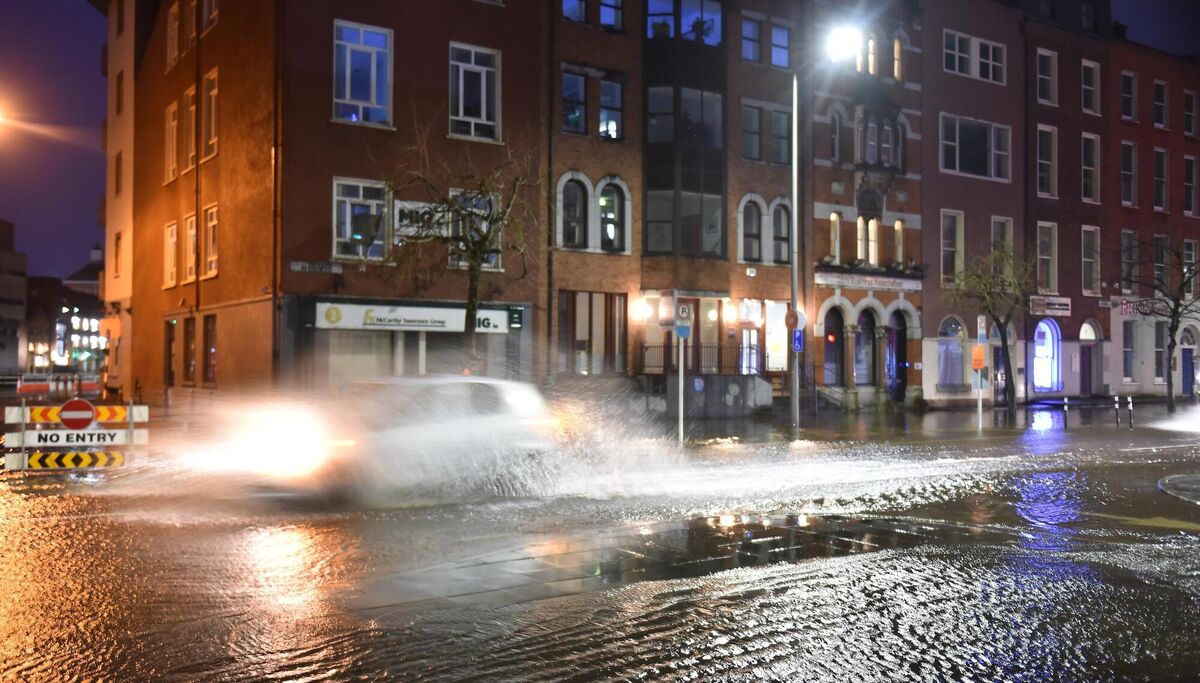 A car makes its way through the floods on the South Mall in Cork city. Picture: Dan Linehan