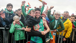 <p>WELL DONE BRO: Darragh McElhinney celebrates with his brother Iarla after finishing second in the Men’s U23 8,000m at the SPAR European Cross Country Championships. 	Picture: Inpho/Bryan Keane</p>
