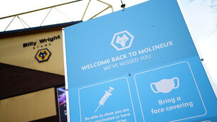 <p>A view of coronavirus safety advice outside the ground before the Premier League match at Molineux Stadium, Wolverhampton. Picture date: Saturday November 20, 2021.</p>