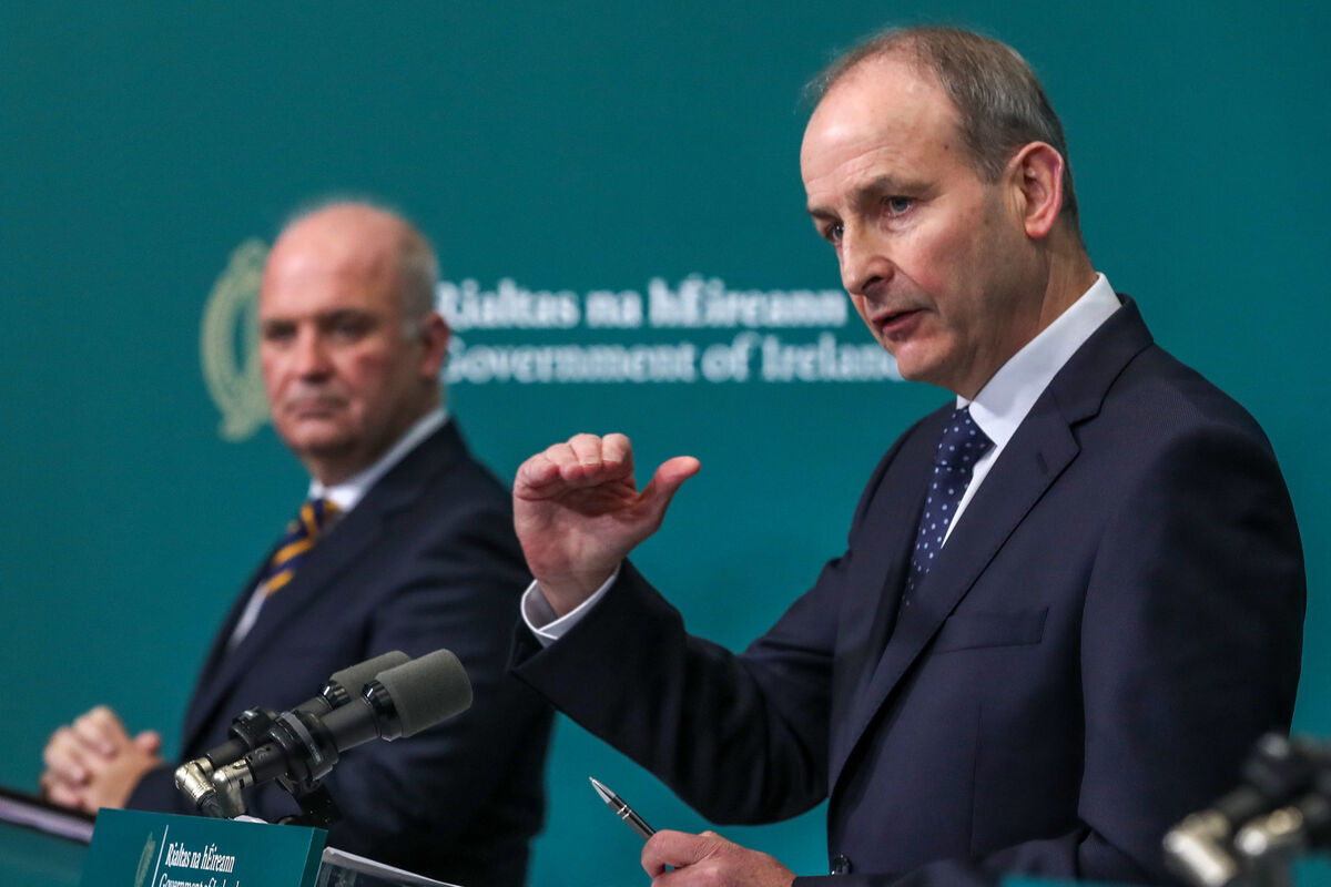 Dr Tony Holohan and Taoiseach Micheal Martin speaking to the media at Government Buildings on Friday. Picture: Julien Behal