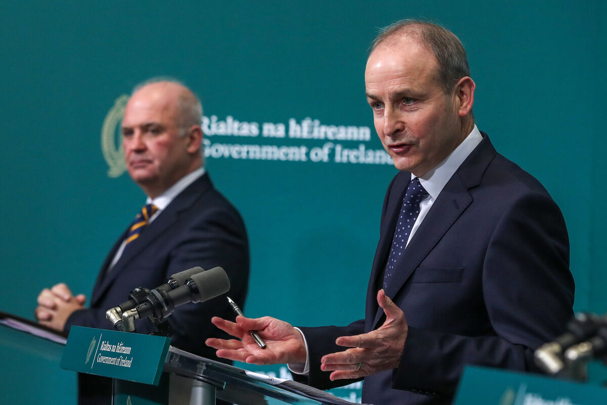 Dr Tony Holohan and Taoiseach Mícheál Martin speaking to the media at Government Buildings last night. Picture: Julien Behal Dr Tony Holohan and Taoiseach Mícheál Martin speaking to the media at Government Buildings last night. Picture: Julien Behal