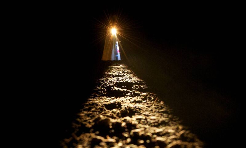 The sun shines along the passage floor into the inner chamber at Newgrange during the 2013 Winter Solstice. Picture: Alan Betson / The Irish Times 