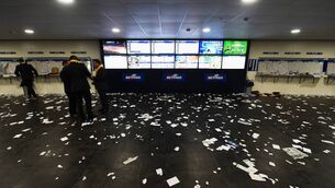 <p>BEATEN DOCKETS: Losing betting slips are left strewn across a Betfred shop during the 2016 Cheltenham Festival. The industry is set for significant change. <span class="contextmenu emphasis CaptionCredit">	Picture: Mike Hewitt/Getty Images</span>
            </p>