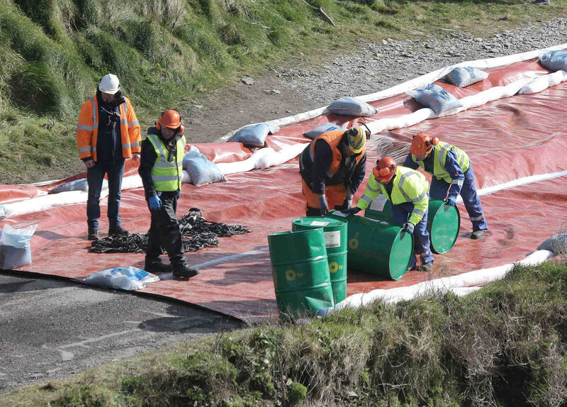 Some of the workers at Ballylanders, East Cork, removing waste barrels as part of Cork County Council’s operations to remove oil and other possible contaminants from the grounded cargo ship, MV Alta, off the coast of Ballycotton, Co. Cork. Picture: John Hennessy