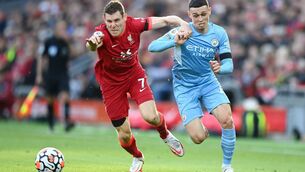 <p>Manchester City’s Phil Foden takes on James Milner of Liverpool. City’s style of play might be playing classical music very precisely, but Liverpool are rock n’ roll, and have their foot up on the stage monitor of life. Picture: Michael Regan/Getty Images</p>