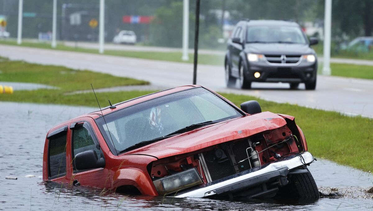 An abandoned vehicle in a ditch in Louisiana during Hurricane Ida this summer. Picture: AP Photo/Steve Helber An abandoned vehicle in a ditch in Louisiana during Hurricane Ida this summer. Picture: AP Photo/Steve Helber