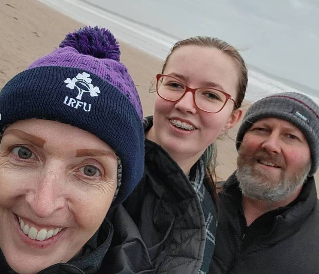 Vicky Phelan with daughter Amelia and husband Jim on Doughmore Beach.