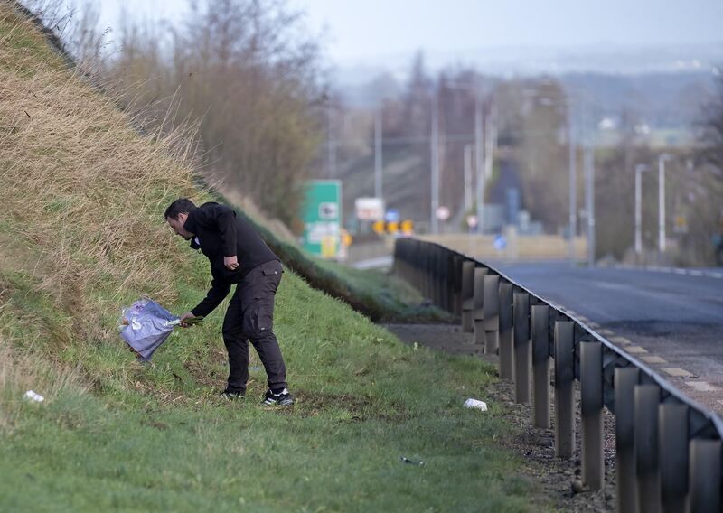 A relative of one of the victims places flowers at the scene this morning. A relative of one of the victims places flowers at the scene this morning.