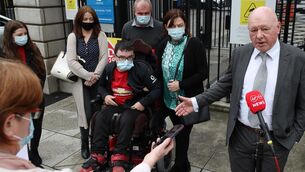 <p>Solicitor Kieran McCarthy speaking to the media in July 2021 alongside Keith Phelan and his sisters, Kelly and Lyndsey, and parents Tony and Margaret, after Keith settled his High Court action for €11m. Picture: Collins Courts</p>