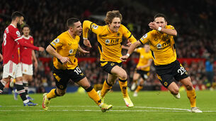 <p>Joao Moutinho (right) celebrates Wolves’ late winner (Martin Rickett/PA).</p>