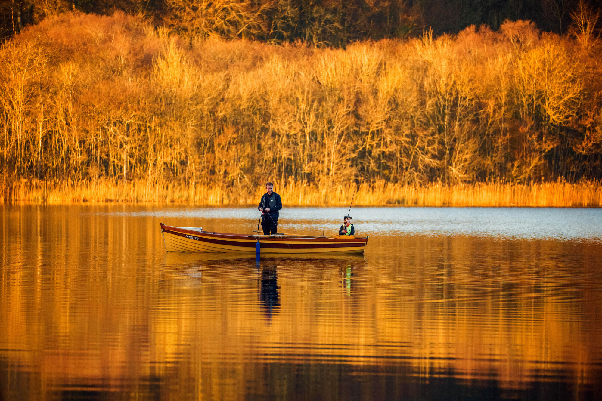 Zachary Harpur, with his son Zaki, 9, from Shankill, Dublin, fishing on Dromoland Lake at Newmarket On Fergus, Co Clare.