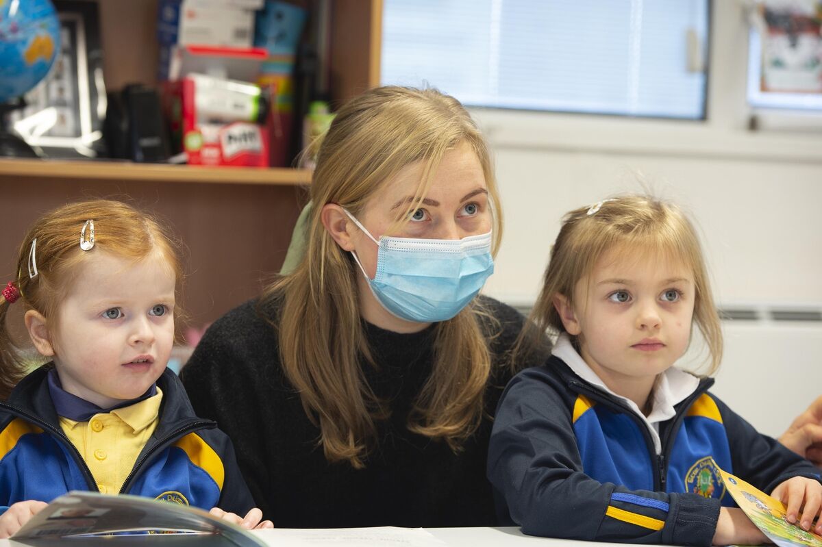 Teacher Niamh O’Connor with young students Sophie Moloney and Guinivere Poulter in Scoil Cliodhna Community National School in Carrigtwohill, Co. Cork.