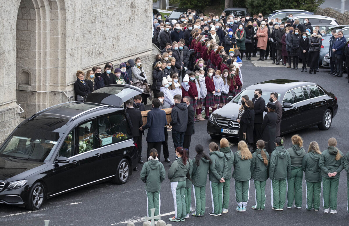 Students from her former secondary school Loreto Foxrock formed a guard of honour as her remains were carried in a wicker coffin adorned with a floral bouquet was brought into the Church of Our Lady of Perpetual Succour in Foxrock this morning. Photo: Colin Keegan