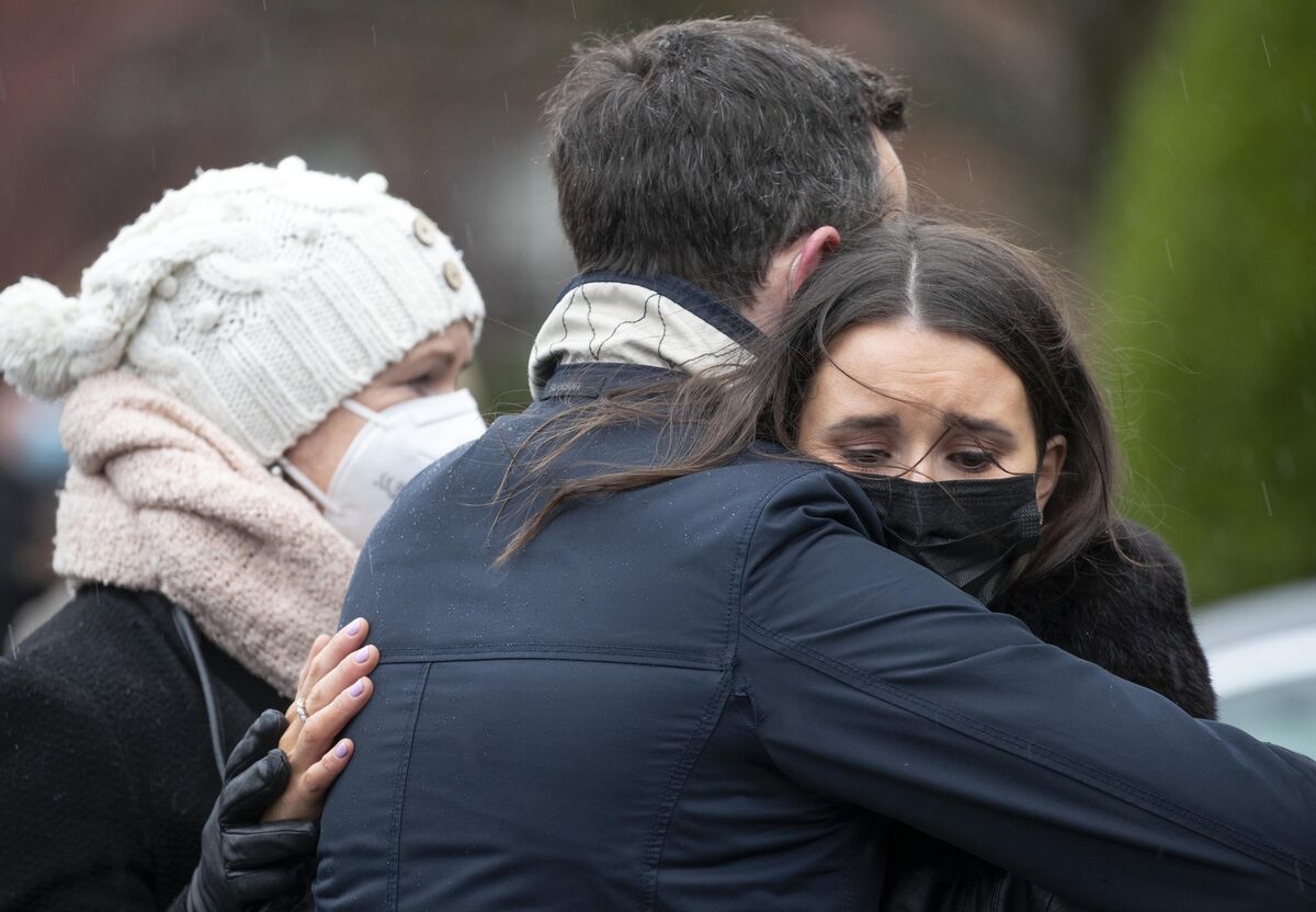 Mourners console each other at the funeral of Aoife Beary today where they heard that she "insisted on living life well." Photo: Colin Keegan