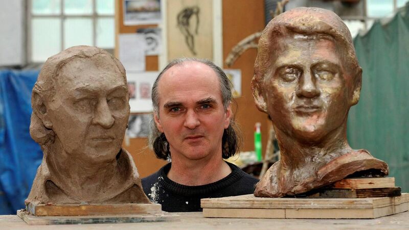 Artist Seán McCarthy with a work in progress of writer Patrick Galvin and the bust of Bill Clinton which is on display in Ballybunion.  Picture: Dan Linehan
