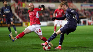 <p>Swindon Town's Jonny Williams (left) and Manchester City's Cole Palmer battle for the ball during the Emirates FA Cup third round match at the Energy Check County Ground, Swindon. Picture: Adam Davy/PA</p>