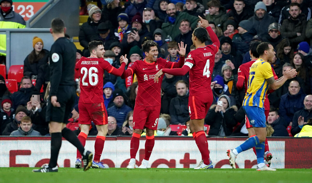 Liverpool's Roberto Firmino (centre) celebrates scoring their side's third goal. Picture: Peter Byrne