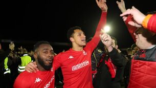 <p>GIANT-KILLING? Kidderminster Harriers players celebrate with fans on the pitch after beating Reading</p>