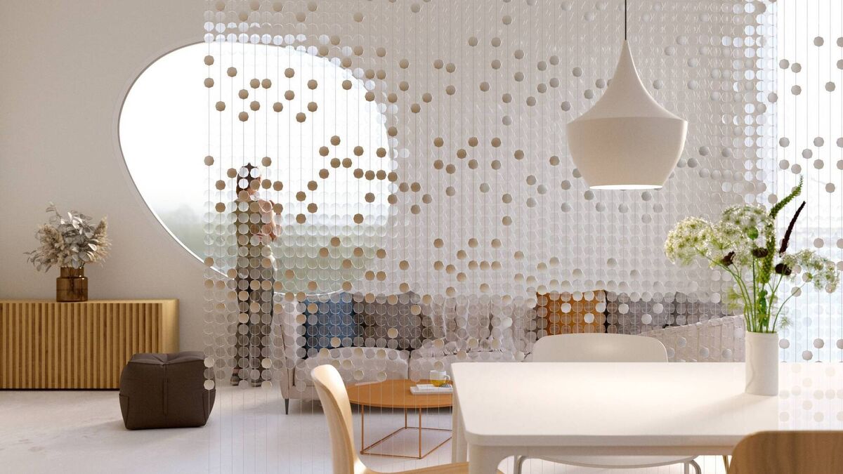 A bespoke boho-inspired curtain of shells disks on vertical lines blurs one end of a contemporary room. Picture: iStock A bespoke boho-inspired curtain of shells disks on vertical lines blurs one end of a contemporary room. Picture: iStock