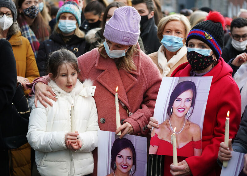 Alanna Norris (9) and her mother Jennifer Collins (second left) attend a vigil at Leinster House, Dublin. Picture: Brian Lawless/PA Wire