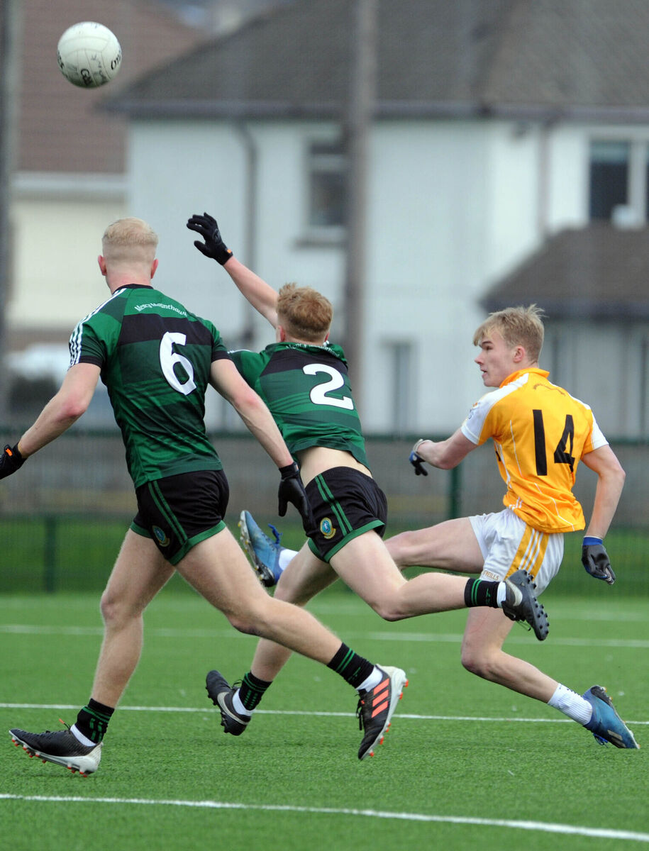  SCORE: Hamilton HS's Richard O'Sullivan shoots past Mounthawk's Danny Jeffers and Joey Nagle at Bishopstown. 