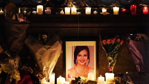 <p>A photo of Ashling Murphy among flowers and candles at a makeshift shrine during a vigil in her memory at Leinster House, Dublin, following her murder while jogging along the Grand Canal in Tullamore, Co Offaly.	<span class="contextmenu emphasis CaptionCredit">Picture: Brian Lawless/PA Wire</span>
            </p>