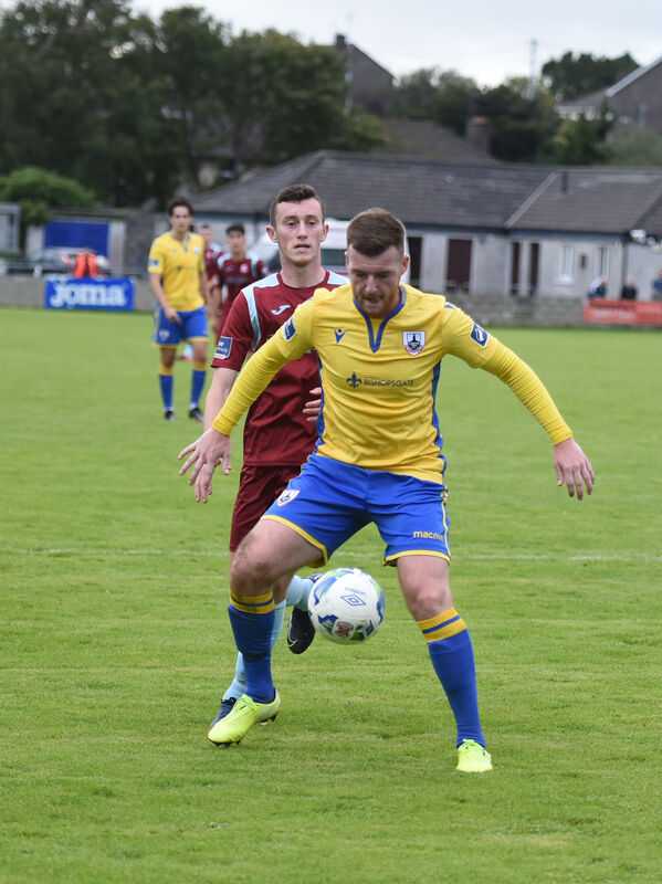  Lee Devitt, Cobh Ramblers keeps the pressure on defender Joe Gorman, Longford Town. Gorman lost a move to the NI Premiership after an old tweet he made resurfaced. Picture: Larry Cummins